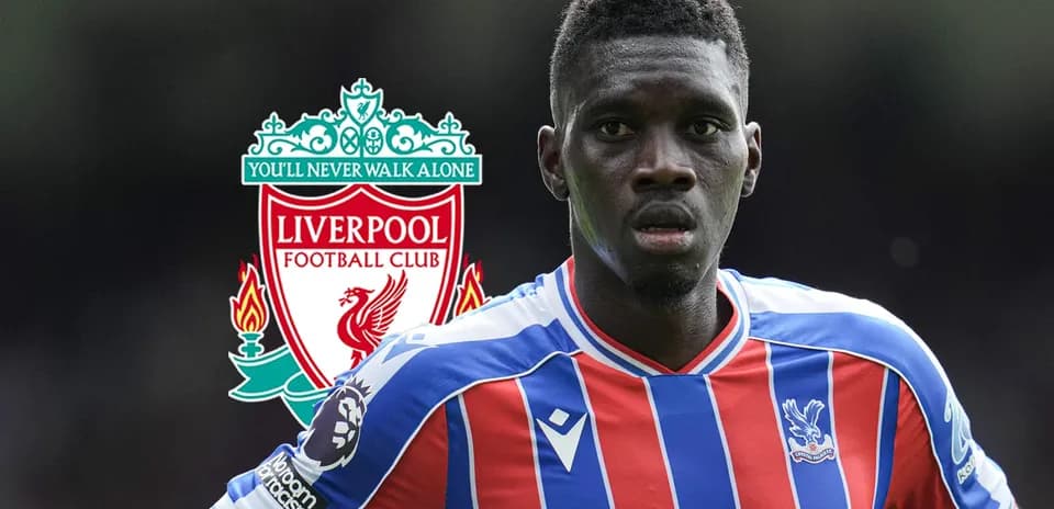 Crystal Palace player with Liverpool logo background