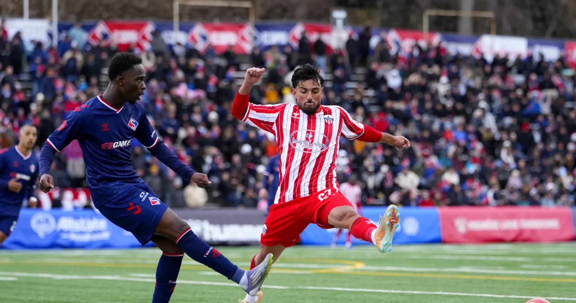 Players contesting for the ball during match