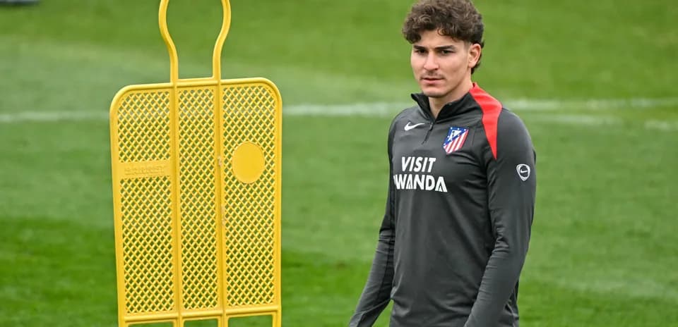 Player standing next to a training dummy on field