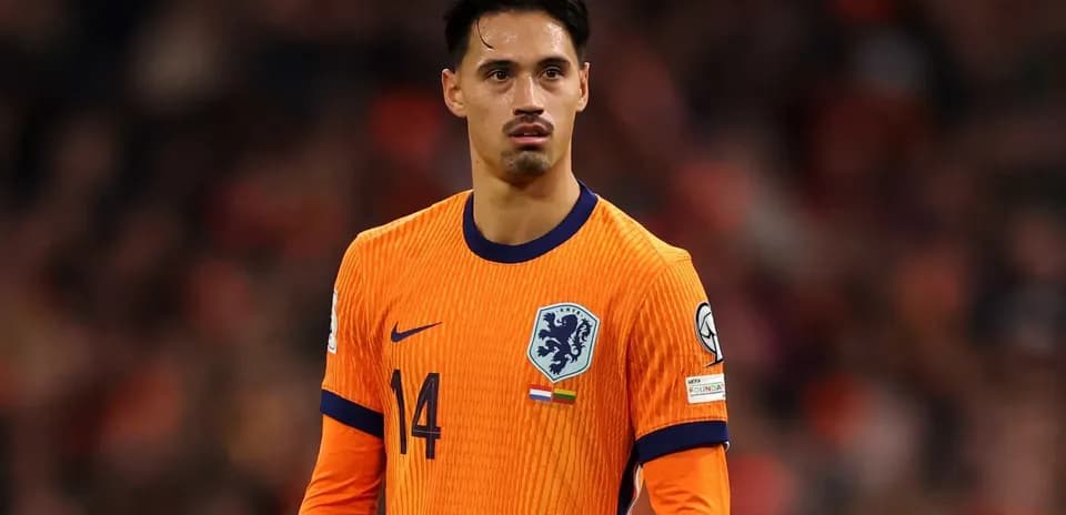 Player in orange kit during football match