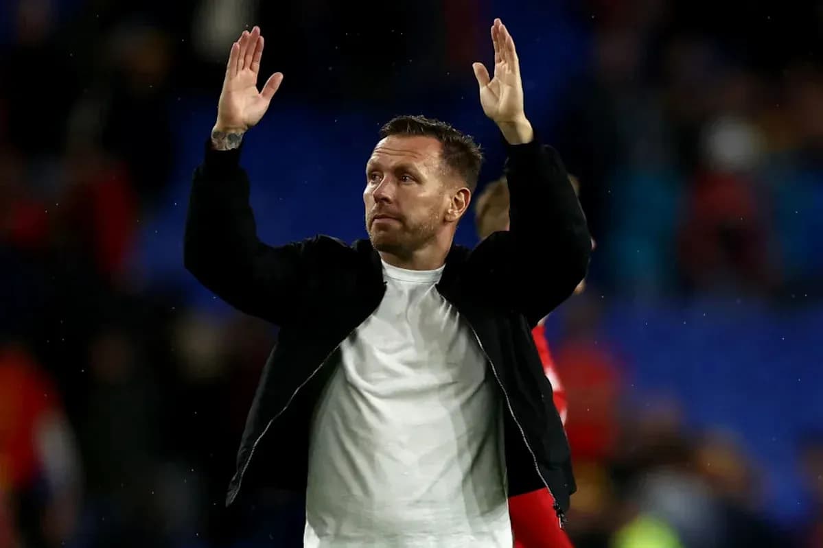 Man waving to fans after a match