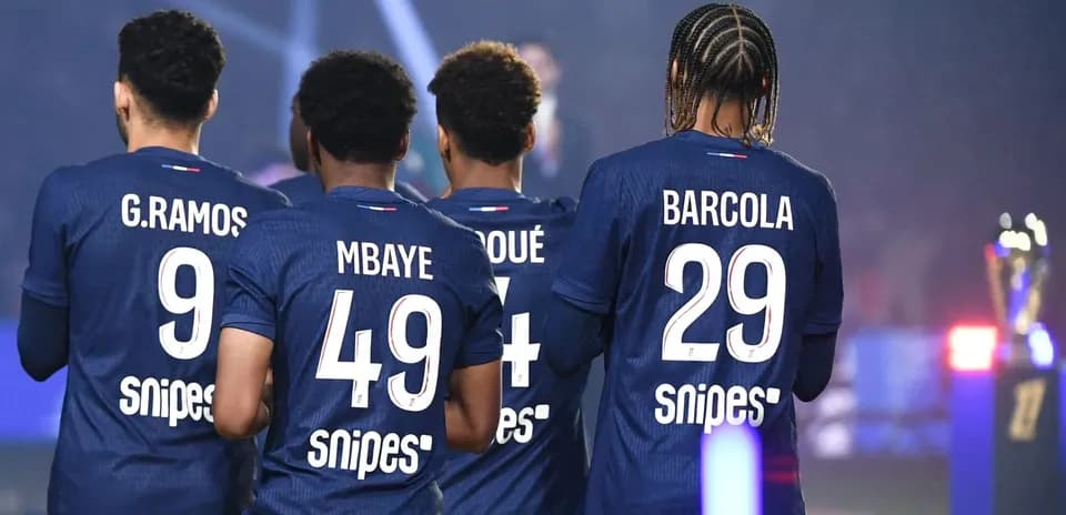 Players from a team in blue jerseys, back view