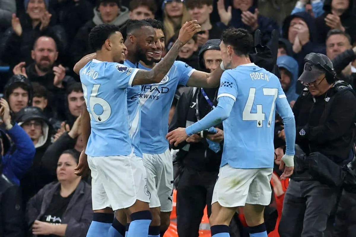 Manchester City players celebrating a goal