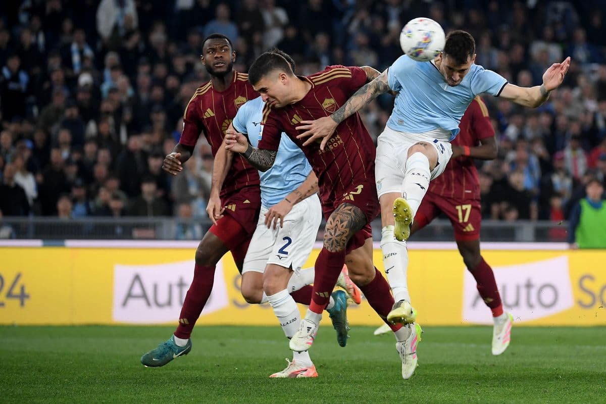 AS Roma players challenging Lazio player for the ball