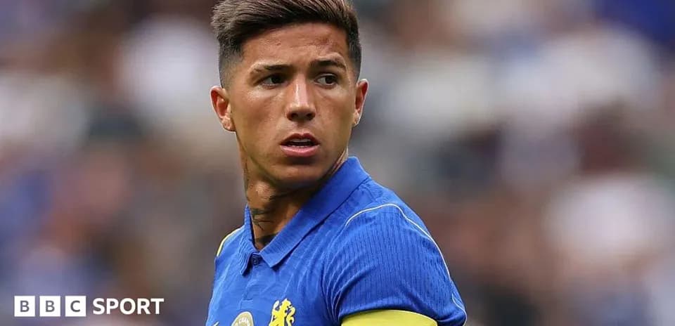 Player wearing blue jersey with captain armband