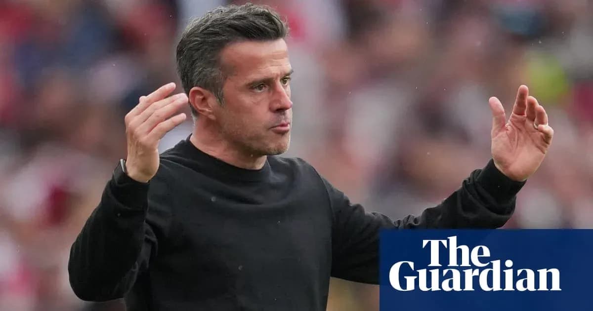Manager gesturing during match from sideline