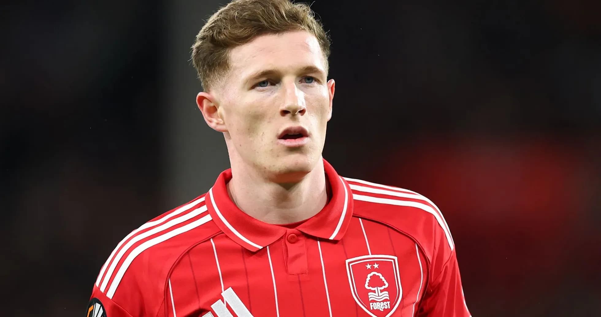 Player wearing red Nottingham Forest jersey on field