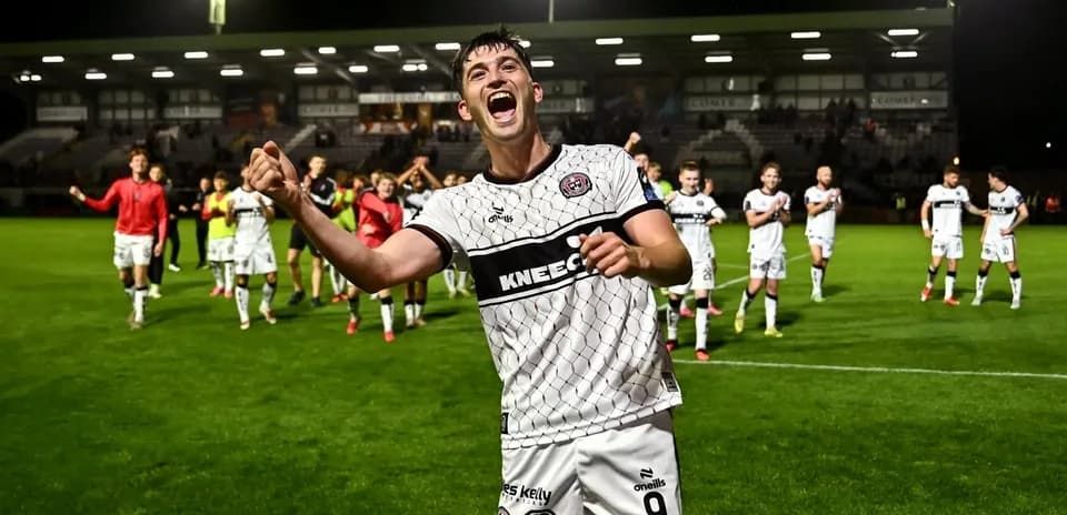 Player celebrating with teammates after match victory