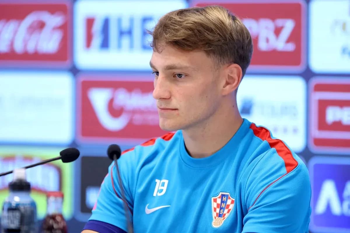 Player at press conference wearing Croatia training kit