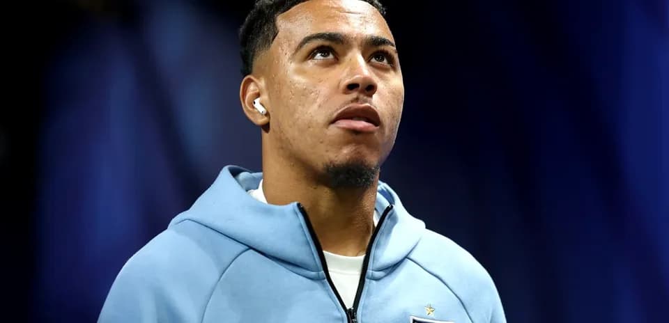 Player wearing England hoodie during press event