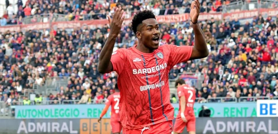 Player celebrating during match with crowd in background