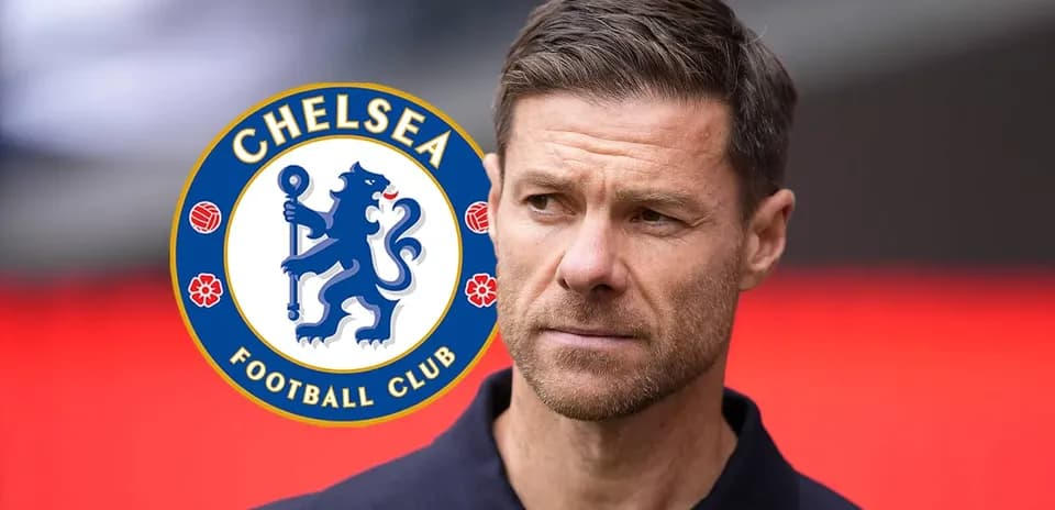 Coach in front of Chelsea Football Club logo