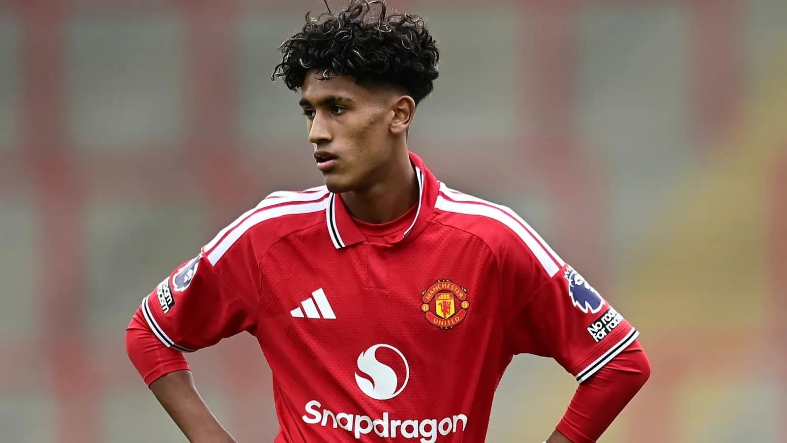 Young player in Manchester United jersey on field