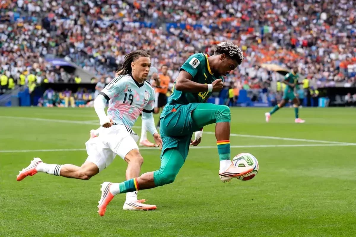 Player dribbling the ball while being chased
