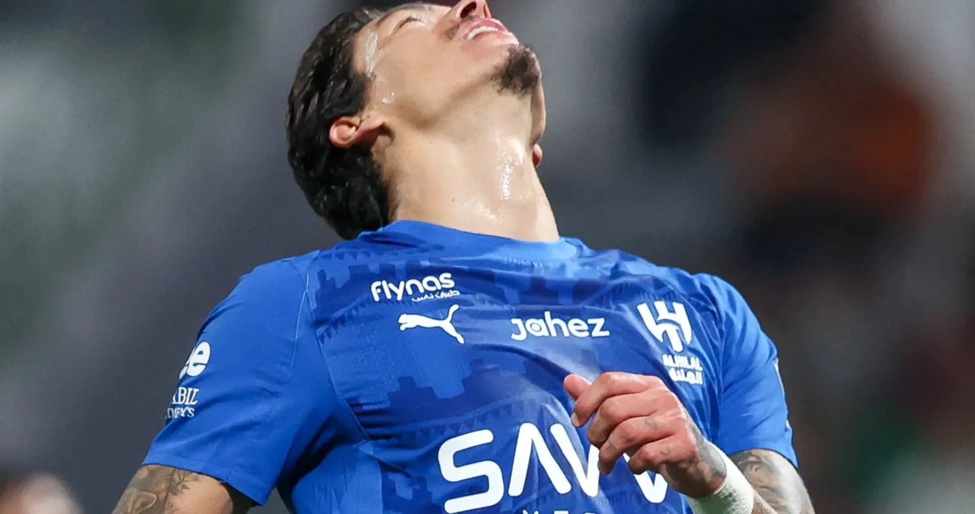 Player in blue jersey reacting during match