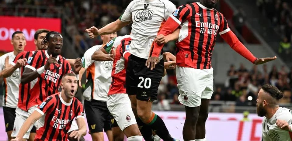 Players contesting a high ball during match