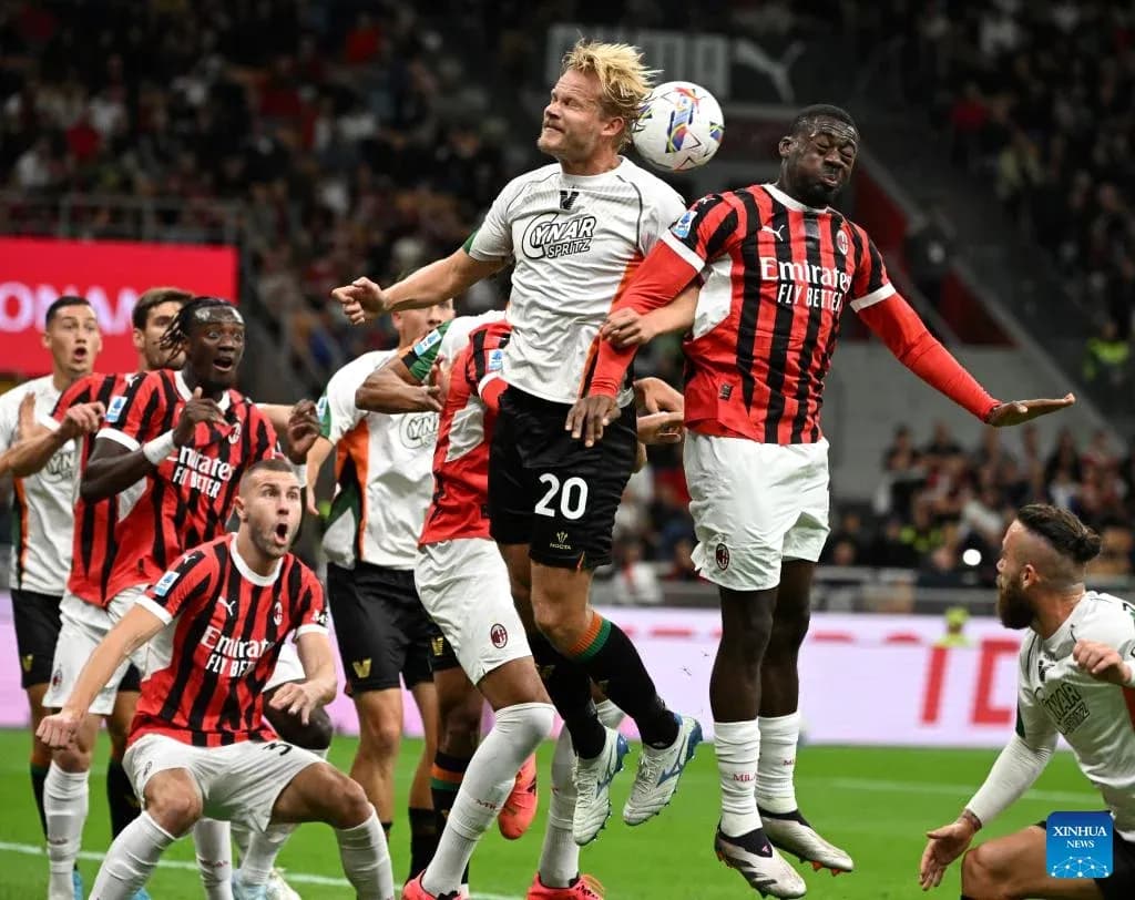 Players contesting a high ball during match