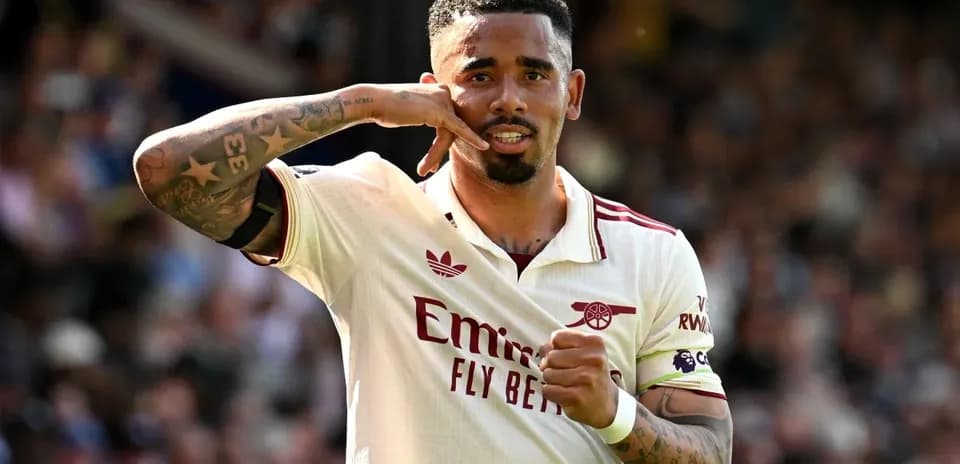 Player celebrating a goal with hand gesture