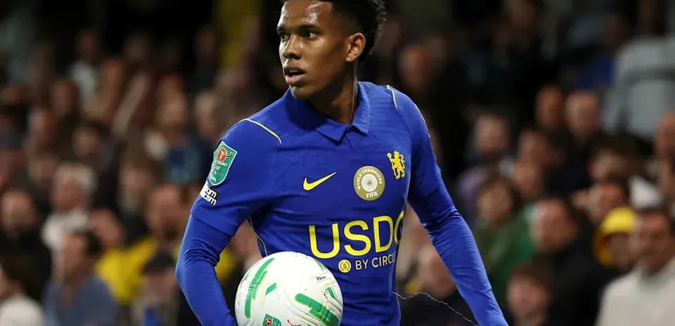 Player in blue kit holding ball during match