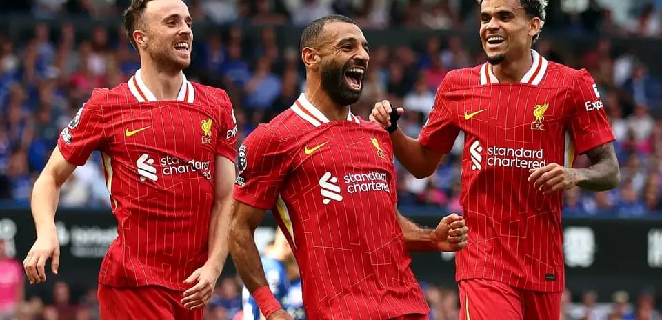Liverpool players celebrating a goal during match
