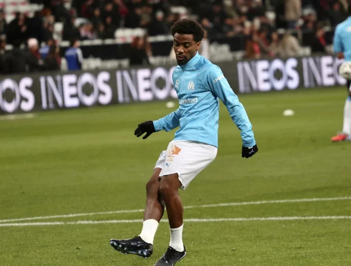 Player warming up on the pitch before match