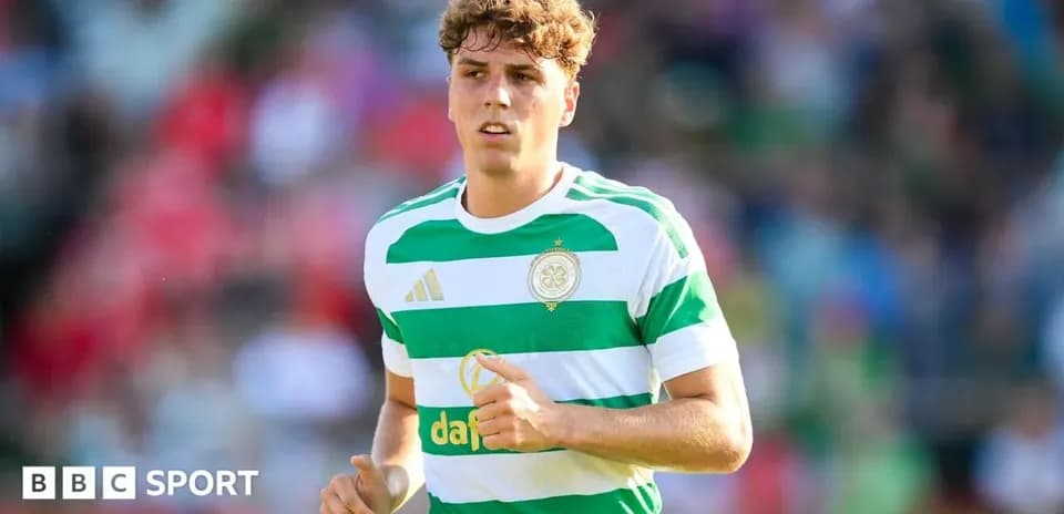 Player wearing Celtic kit during match on field
