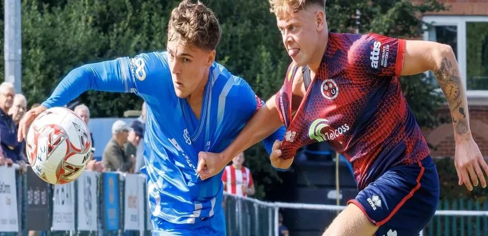 Two players competing for the ball during a match