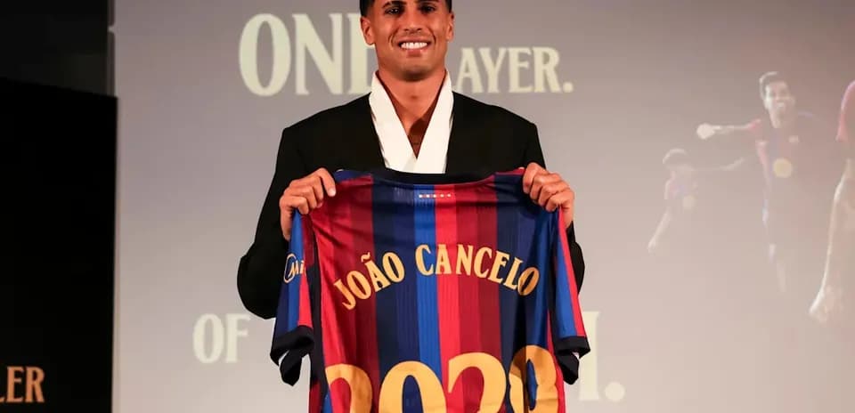 Player holding FC Barcelona jersey at presentation