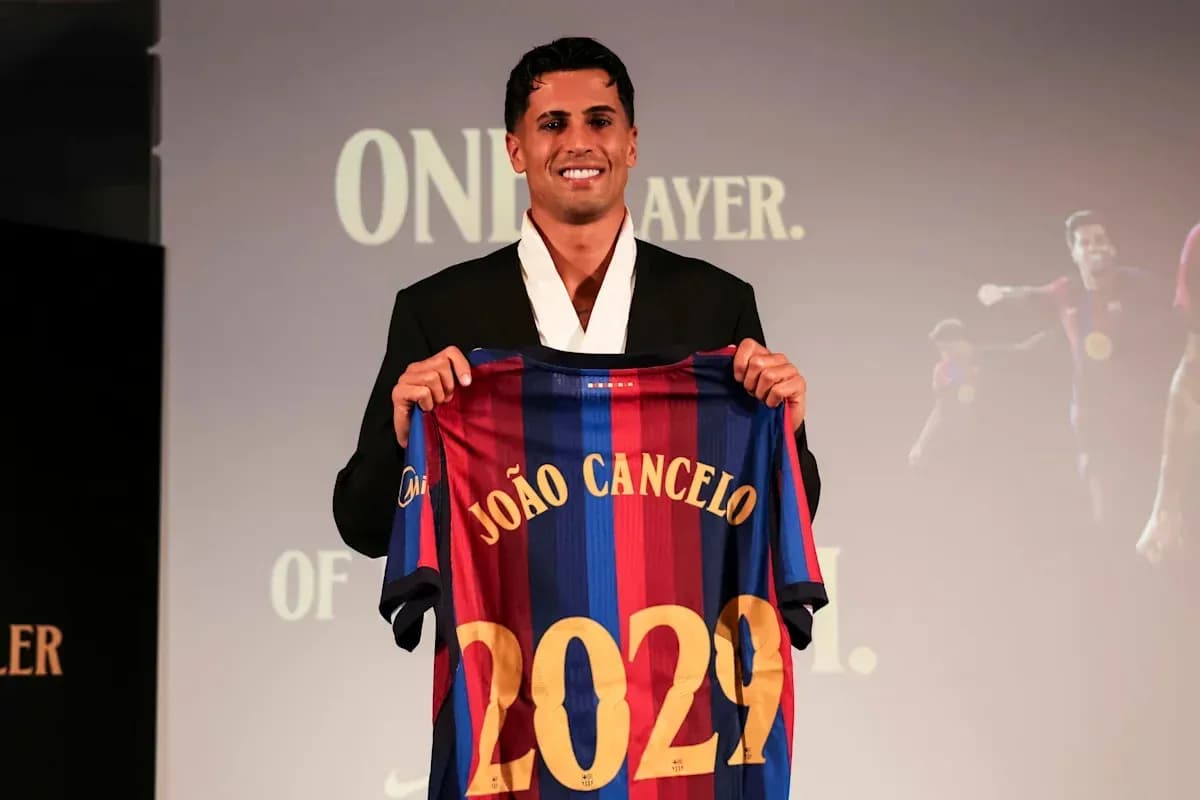 Player holding FC Barcelona jersey at presentation