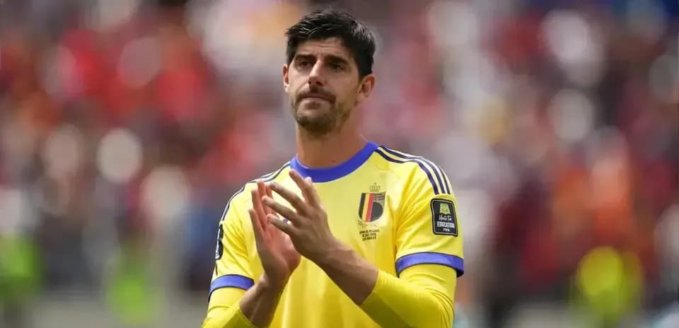 Goalkeeper applauding in yellow kit during match