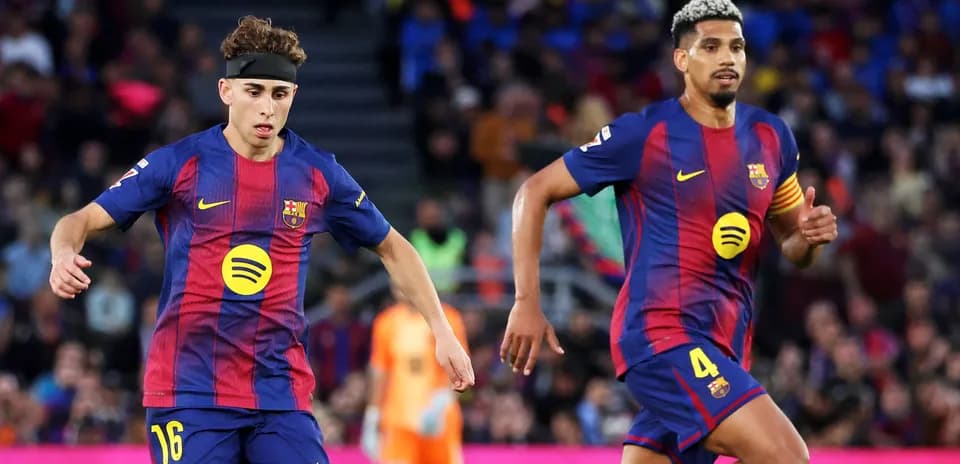 Two FC Barcelona players during a match