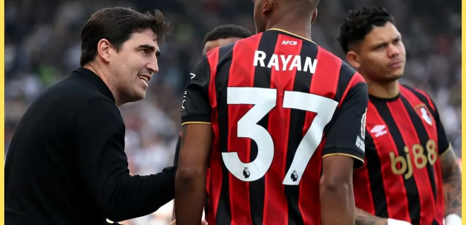 Manager discussing tactics with Bournemouth players during match