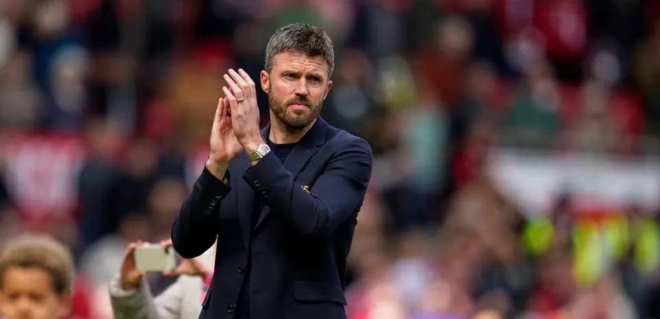 Coach applauding the crowd after the match