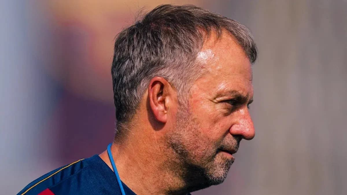 Coach observing training session at outdoor facility