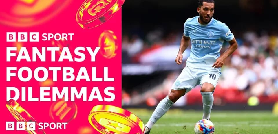 Player in light blue kit dribbling during match