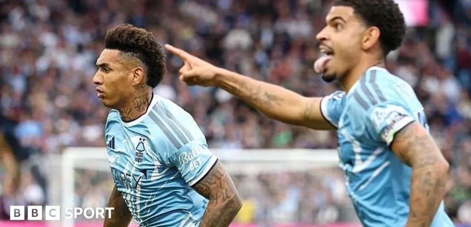 Two players celebrating during a football match