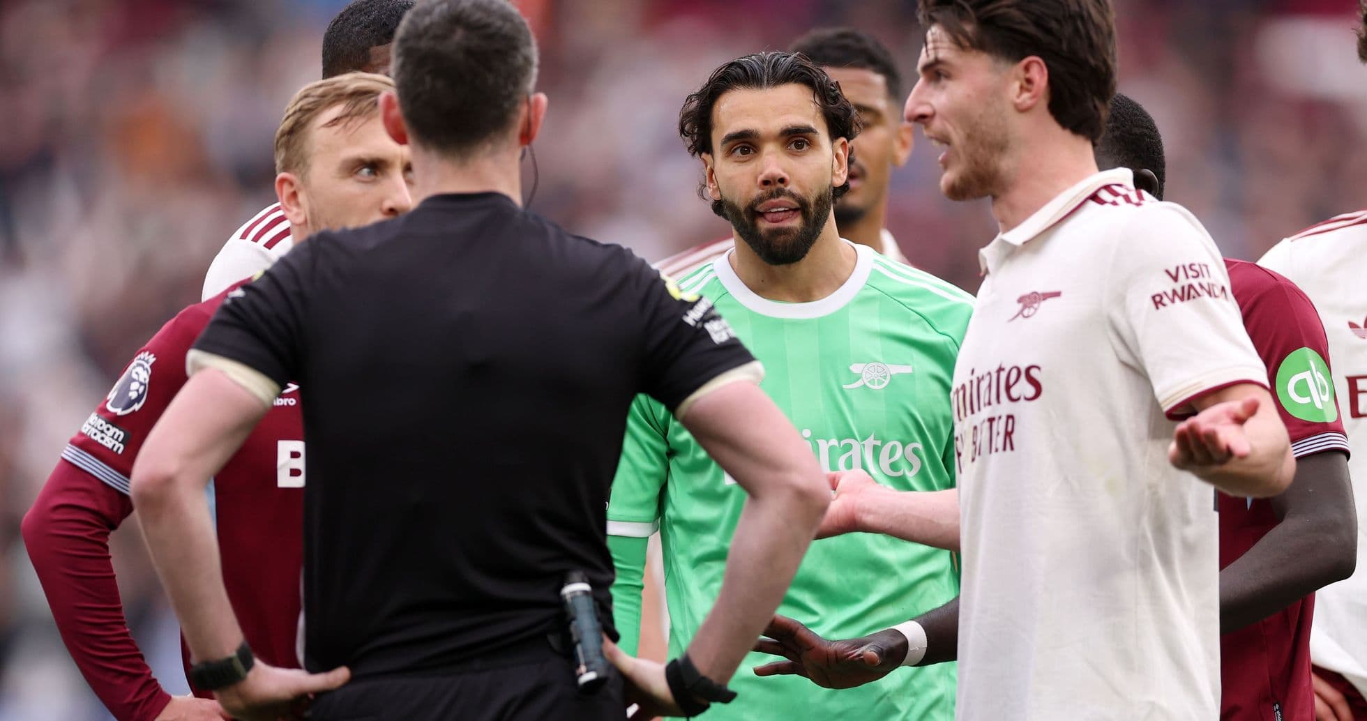 Players discussing with the referee during match