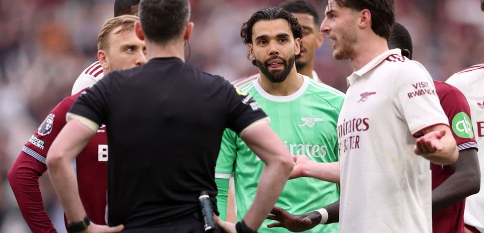 Players discussing with the referee during match