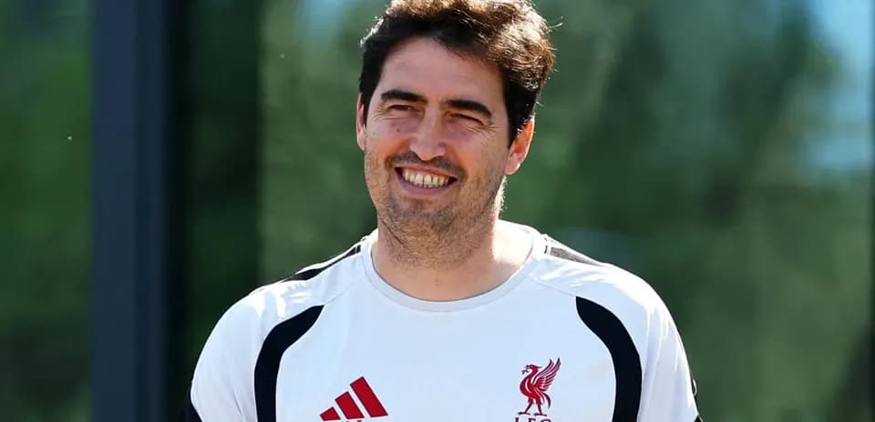 Coach smiling during training session at Liverpool