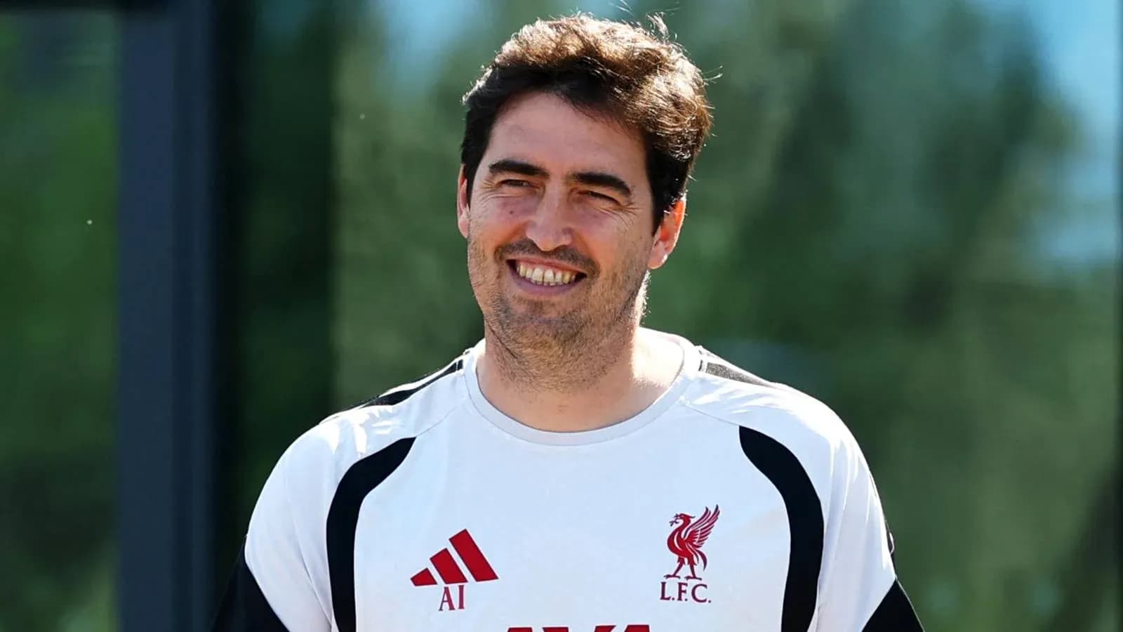 Coach smiling during training session at Liverpool