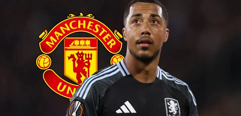 Aston Villa player in front of Manchester United logo