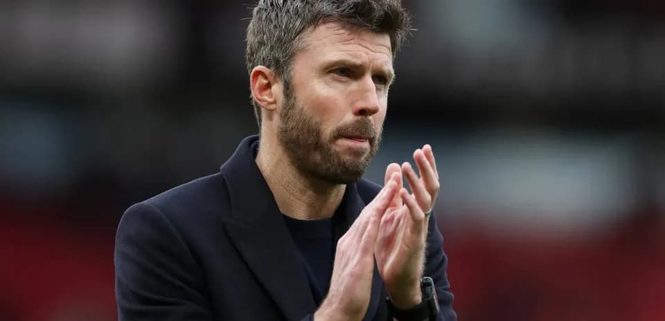 Coach applauding during a match at the stadium