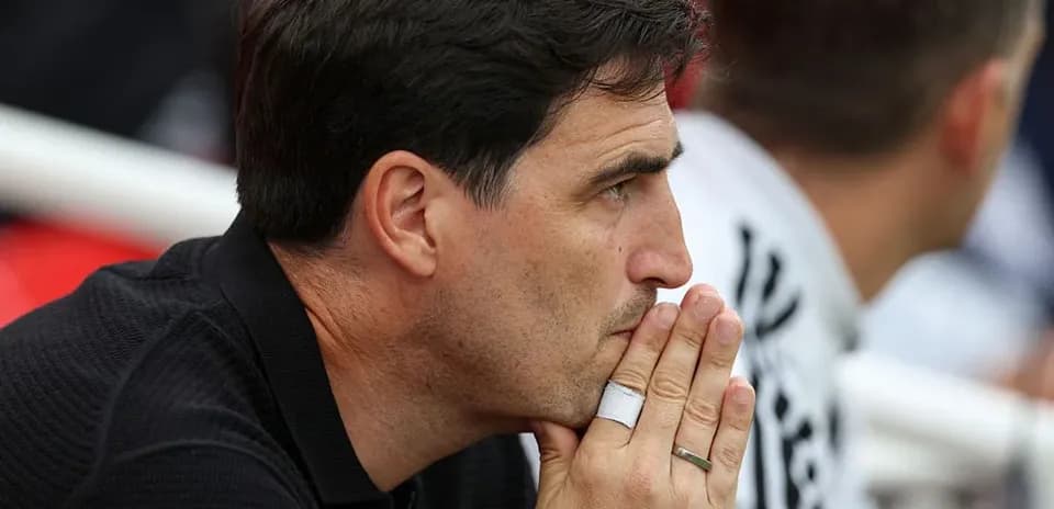 Coach observing match from the sidelines