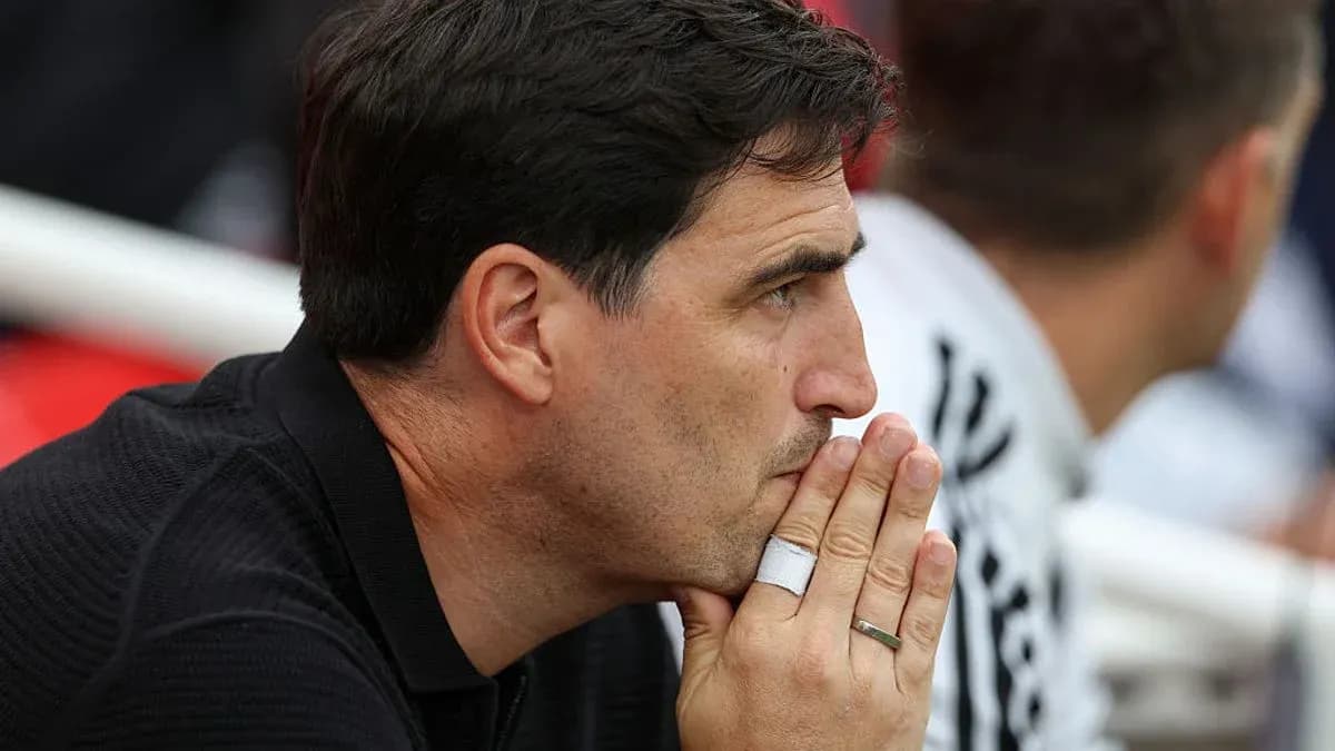 Coach observing match from the sidelines