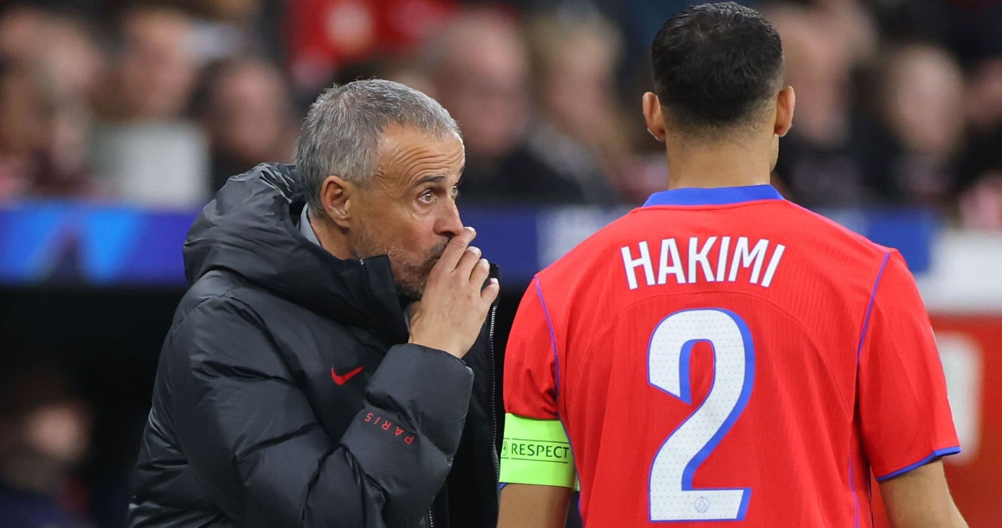 Coach giving instructions to player Hakimi during match