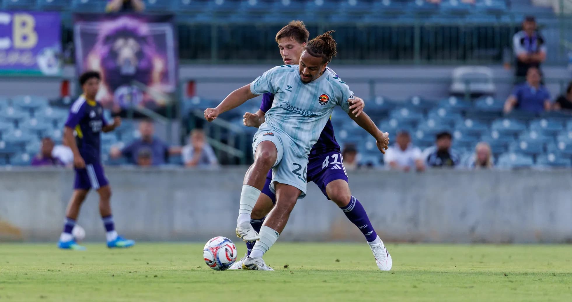 Players competing for the ball during match