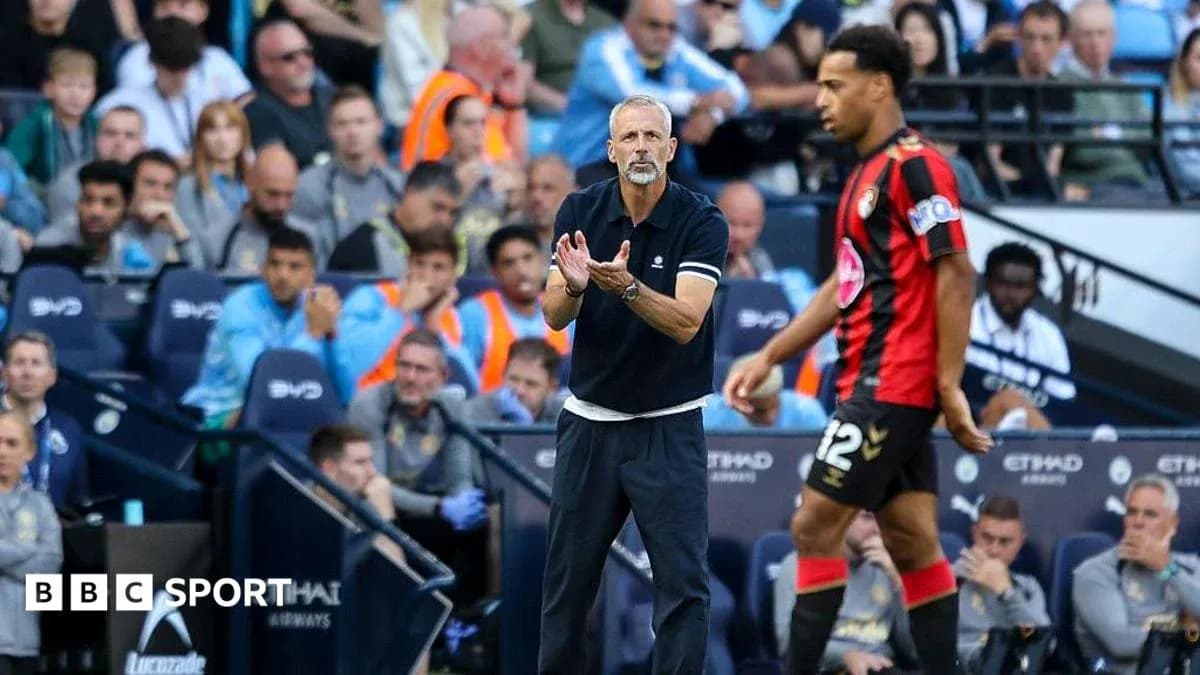 Manager directing player during match at stadium