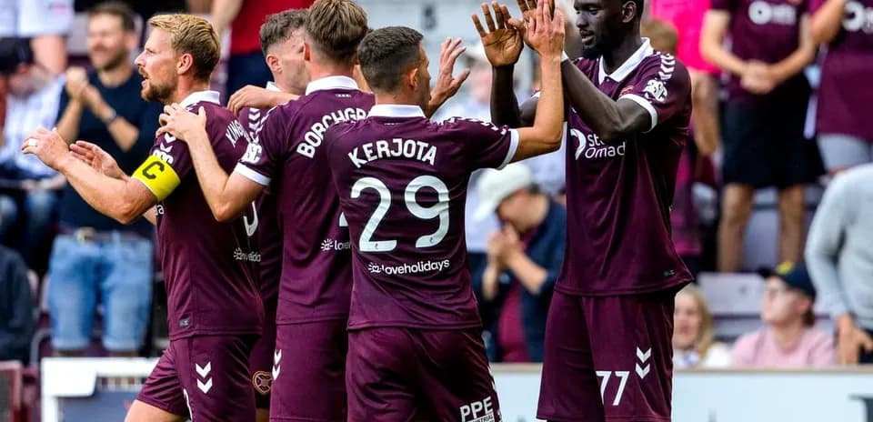 Hearts players celebrating a goal together