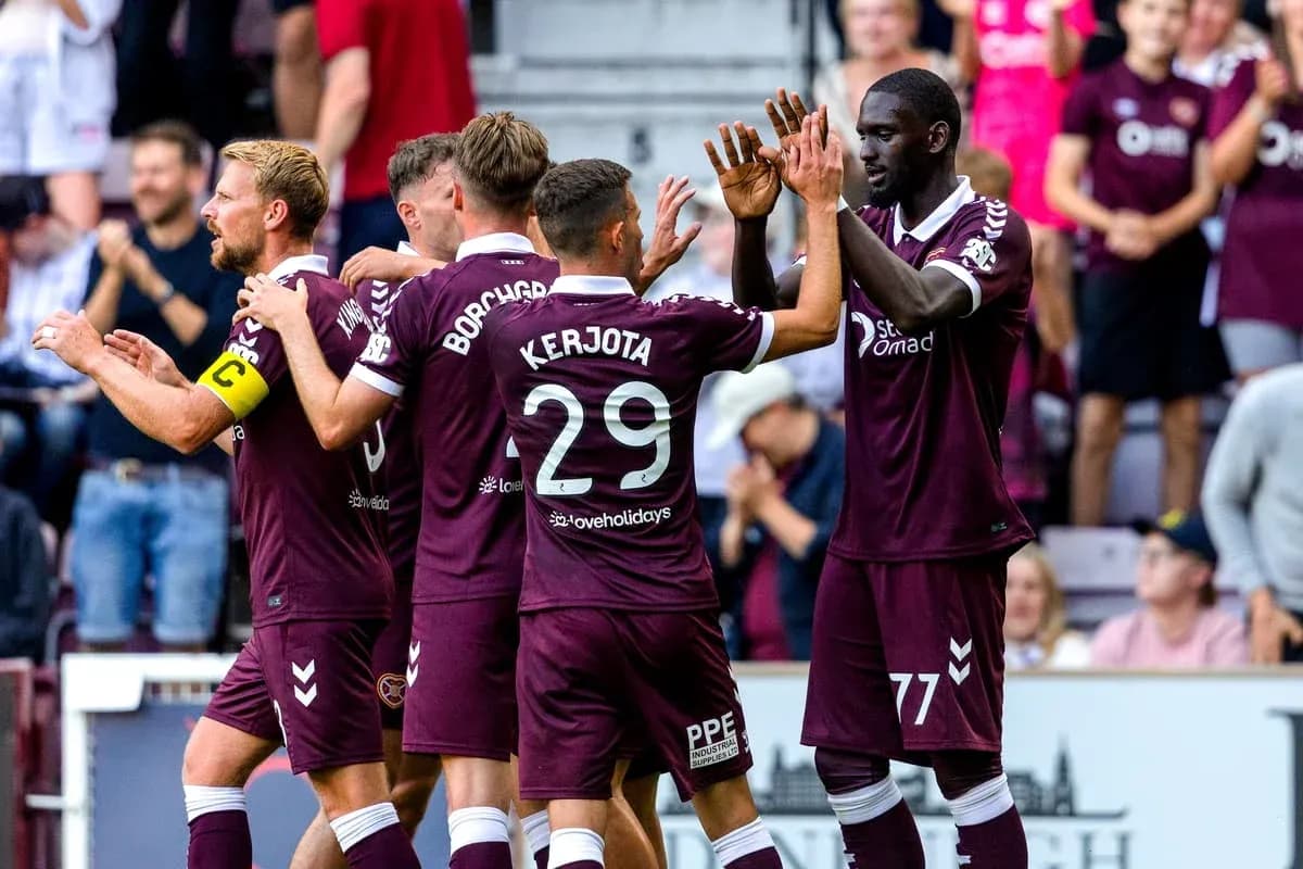 Hearts players celebrating a goal together