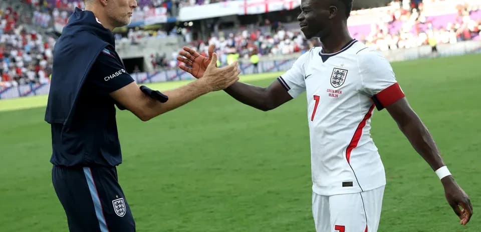Coach and player shaking hands after the match
